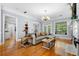 Bright living room with hardwood floors, fireplace, and large windows at 450 Bay Grove Se Rd, Loganville, GA 30052