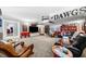 Spacious living room decorated with sports memorabilia, featuring comfortable seating and ample space for recreation at 450 Bay Grove Se Rd, Loganville, GA 30052