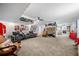 Expansive living room decorated with sports memorabilia, offering ample space for comfortable seating and recreation at 450 Bay Grove Se Rd, Loganville, GA 30052