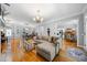 Open concept living room and dining area with hardwood floors and natural light at 450 Bay Grove Se Rd, Loganville, GA 30052