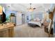 Large, bright main bedroom with elegant decor, vaulted ceilings, and comfortable seating at 450 Bay Grove Se Rd, Loganville, GA 30052