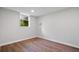 Finished basement bedroom featuring vinyl floors, a window to the exterior, and gray walls at 50 Stonington Pl, Marietta, GA 30068