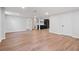 Spacious basement with vinyl floors, showcasing a bar area and a door leading to another room at 50 Stonington Pl, Marietta, GA 30068