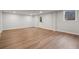Large basement with sleek vinyl floors, a door to the exterior, and a window allowing natural light at 50 Stonington Pl, Marietta, GA 30068
