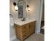 This is a stylish bathroom with a marble countertop, wood cabinet, and a sleek black faucet at 50 Stonington Pl, Marietta, GA 30068