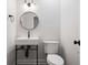 Modern half-bathroom with a sleek vessel sink, black fixtures, and tiled floor at 50 Stonington Pl, Marietta, GA 30068