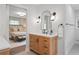 Stylish bathroom with wood vanity, modern fixtures, and access to bedroom; offering luxury and comfort at 50 Stonington Pl, Marietta, GA 30068
