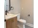 Bright, functional bathroom with wood vanity and modern fixtures provide everyday convenience at 50 Stonington Pl, Marietta, GA 30068