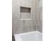 Close-up of a tiled shower nook and bathtub with modern fixtures at 50 Stonington Pl, Marietta, GA 30068