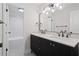Modern bathroom featuring a double vanity, marble countertop, and shower and bathtub combo at 50 Stonington Pl, Marietta, GA 30068
