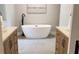 A stylish bathroom features -and- wooden vanities and a standalone tub at 50 Stonington Pl, Marietta, GA 30068