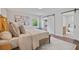 Comfortable bedroom with a sliding barn door to the closet and a glimpse of the ensuite bath at 50 Stonington Pl, Marietta, GA 30068