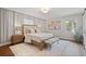 Elegant bedroom featuring neutral tones, decorative art, and ample natural light at 50 Stonington Pl, Marietta, GA 30068