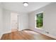 Inviting bedroom with hardwood floors, closet, and a large window offering plenty of natural light at 50 Stonington Pl, Marietta, GA 30068