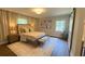 Cozy bedroom with a neutral color scheme, a plush rug, and soft, natural light at 50 Stonington Pl, Marietta, GA 30068