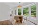 Bright breakfast nook with large windows overlooking the backyard at 50 Stonington Pl, Marietta, GA 30068