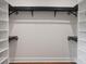 Functional walk-in closet featuring custom shelving and hanging rods for organized storage at 50 Stonington Pl, Marietta, GA 30068