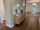 Inviting entryway with stylish wood flooring and a decorative mirror creating a warm ambiance at 50 Stonington Pl, Marietta, GA 30068