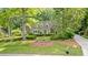 Charming home surrounded by mature trees and lush landscaping, offering a serene setting at 50 Stonington Pl, Marietta, GA 30068