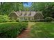 Charming home featuring brick accents, dormer windows and a lush, well-manicured lawn at 50 Stonington Pl, Marietta, GA 30068