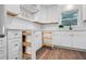 Kitchen with white cabinets, custom spice rack, and stainless appliances at 50 Stonington Pl, Marietta, GA 30068