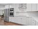 Modern kitchen featuring stainless steel appliances, a built-in oven, and sleek countertops at 50 Stonington Pl, Marietta, GA 30068