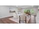 Stylish living room with wood flooring, contemporary decor, and large windows, offering abundant natural light at 50 Stonington Pl, Marietta, GA 30068