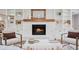 Close-up view of fireplace and built-in shelving in a well-decorated living room with wood floor at 50 Stonington Pl, Marietta, GA 30068