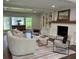 Cozy living room featuring a fireplace, built-in bookshelves, and comfortable seating arrangement at 50 Stonington Pl, Marietta, GA 30068
