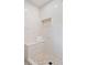 Modern shower with white tiled walls, mosaic floor, built-in niche, and a shower bench at 50 Stonington Pl, Marietta, GA 30068