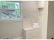Inviting tiled shower with built-in seat and storage niche offers a spa-like experience at 50 Stonington Pl, Marietta, GA 30068