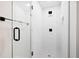 Modern shower featuring glass doors, white tiles, and stylish fixtures for a spa-like experience at 50 Stonington Pl, Marietta, GA 30068