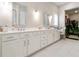 Luxurious bathroom with dual sinks, a vanity area, and plenty of storage space at 719 Elizabeth Trl, Woodstock, GA 30189