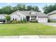 Charming single-Gathering home with a well-manicured lawn and a welcoming front porch at 719 Elizabeth Trl, Woodstock, GA 30189