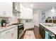 Modern kitchen with stainless steel appliances, granite countertops, and ample cabinet space at 719 Elizabeth Trl, Woodstock, GA 30189