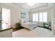 Serene main bedroom featuring soft colors, tray ceilings, and ample natural light at 719 Elizabeth Trl, Woodstock, GA 30189