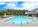Community pool featuring lounge chairs, an outdoor lounge, and a zero entry point with chair access at 719 Elizabeth Trl, Woodstock, GA 30189