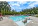 Community pool featuring lounge chairs, an outdoor lounge, and a zero entry point with chair access at 719 Elizabeth Trl, Woodstock, GA 30189