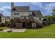 Spacious backyard featuring a wooden deck, a well-maintained lawn, and outdoor space for recreation and relaxation at 1365 Juniper Springs Trl, Loganville, GA 30052