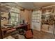View of basement with work desk, window, and an open sliding barn door at 1365 Juniper Springs Trl, Loganville, GA 30052