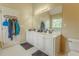 Bathroom features double sinks, large mirror and plenty of counterspace at 1365 Juniper Springs Trl, Loganville, GA 30052