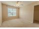 Bedroom featuring neutral paint, carpet flooring, natural light, and closet at 1365 Juniper Springs Trl, Loganville, GA 30052