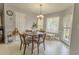 Bright breakfast nook with natural light, wooden table, and cozy seating at 1365 Juniper Springs Trl, Loganville, GA 30052