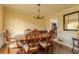 Formal dining room with traditional furnishings, chandelier, and wood flooring at 1365 Juniper Springs Trl, Loganville, GA 30052