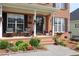 Inviting front porch with seating and seasonal decorations, adding curb appeal at 1365 Juniper Springs Trl, Loganville, GA 30052