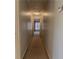 Hallway featuring carpet flooring, neutral paint, and overhead lighting at 1365 Juniper Springs Trl, Loganville, GA 30052