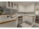 Updated kitchen with white cabinets, stainless steel appliances, and modern fixtures at 1365 Juniper Springs Trl, Loganville, GA 30052