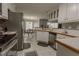 Updated kitchen with stainless steel appliances and a view to the dining area at 1365 Juniper Springs Trl, Loganville, GA 30052