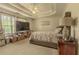Well-lit main bedroom features a ceiling fan, a tray ceiling, and large windows at 1365 Juniper Springs Trl, Loganville, GA 30052