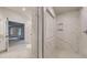 Bathroom featuring a shower with marble tiling, vanity, and view into main bedroom at 145 Bre Dr, Fayetteville, GA 30215